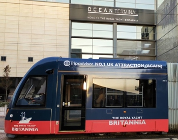 Tram featuring advertising for The Royal Yacht Britannia in front of Ocean Terminal building Tram featuring advertising for The Royal Yacht Britannia in front of Ocean Terminal building