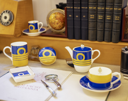 The Admiral collection of chinaware set out on a desk.